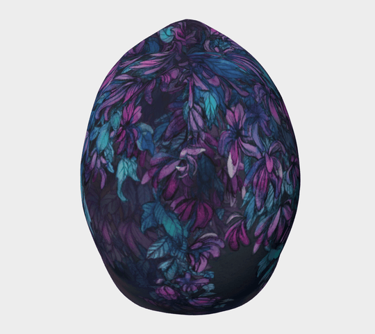 A close-up of the Wisteria beanie from an angle, highlighting the detailed purple and blue floral design.
