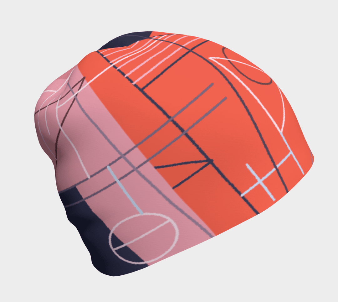Women's pink and orange abstract graphic beanie, side view.