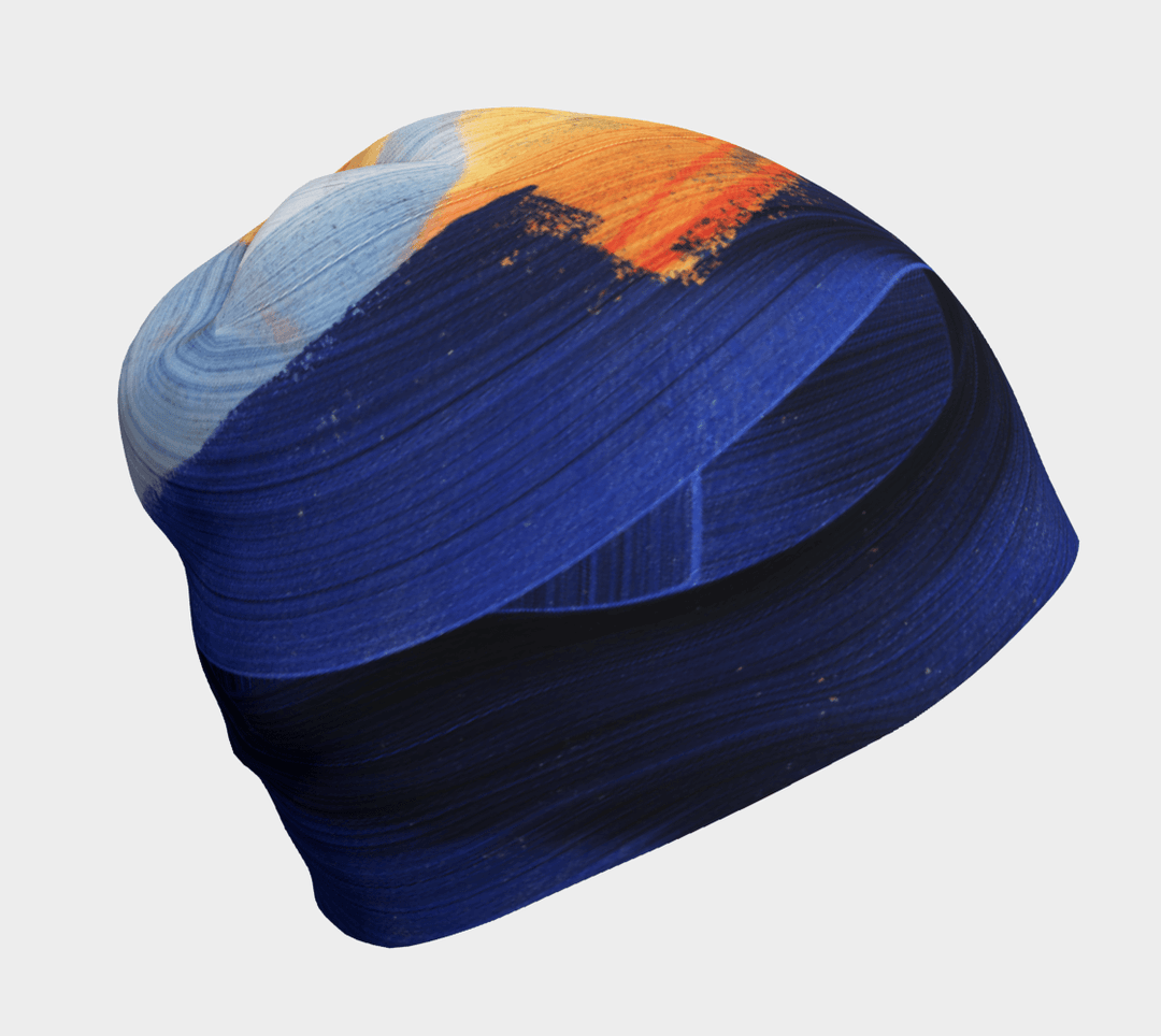 Yellow and blue abstract art beanie, shown from the front.