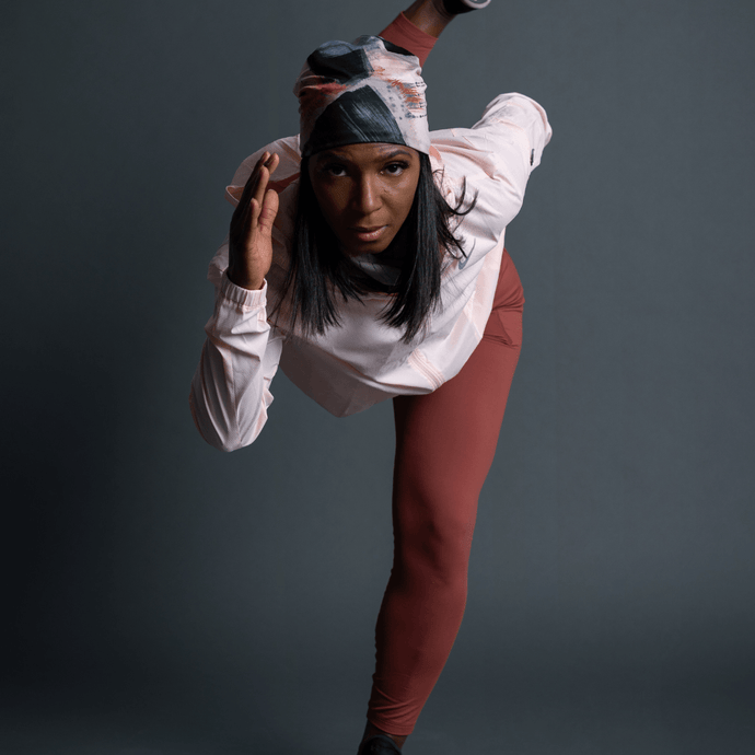 Sportive woman ready to head outside for her run wearing La Vie en Rose beanie and assorted multifunctional tube by Catherine Parent for Lalita's Art Shop.