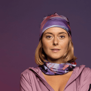 Woman wearing the Lilac and Purple Tulips Beanie with Black Pompom by Catherine Parent for the Lalita's Art Shop 25 collection