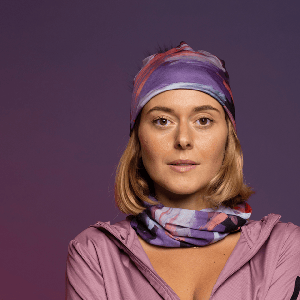 Woman wearing her Pink and Lilac sport outfit with the Tulips Multifunctional Tube by Catherine Parent for the Lalita's Art Shop 25 collection