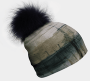 With its blend of Green and Beige hues, the Wall Beanie by Elise Charette can be worn with or without the fur pompom
